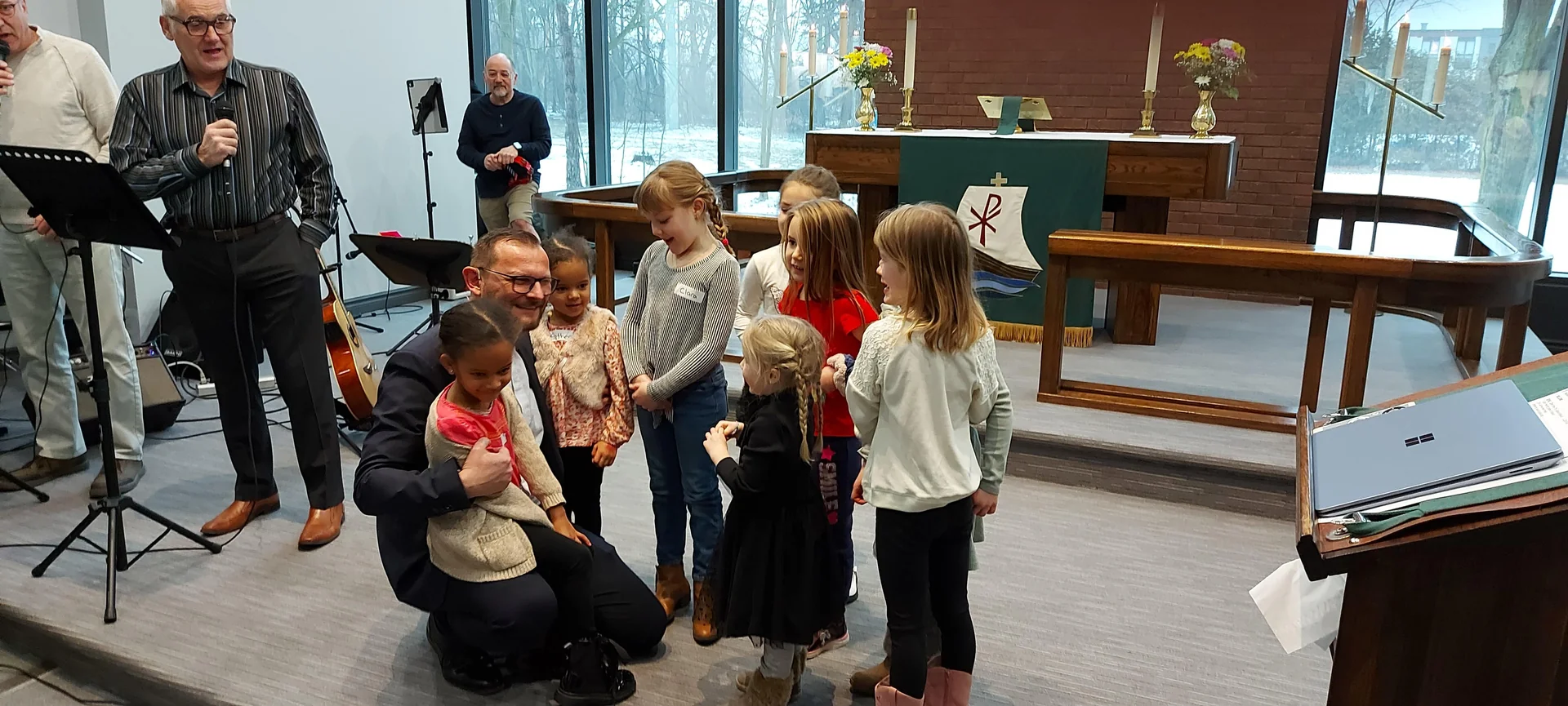 Children gathered at the front of the sanctuary